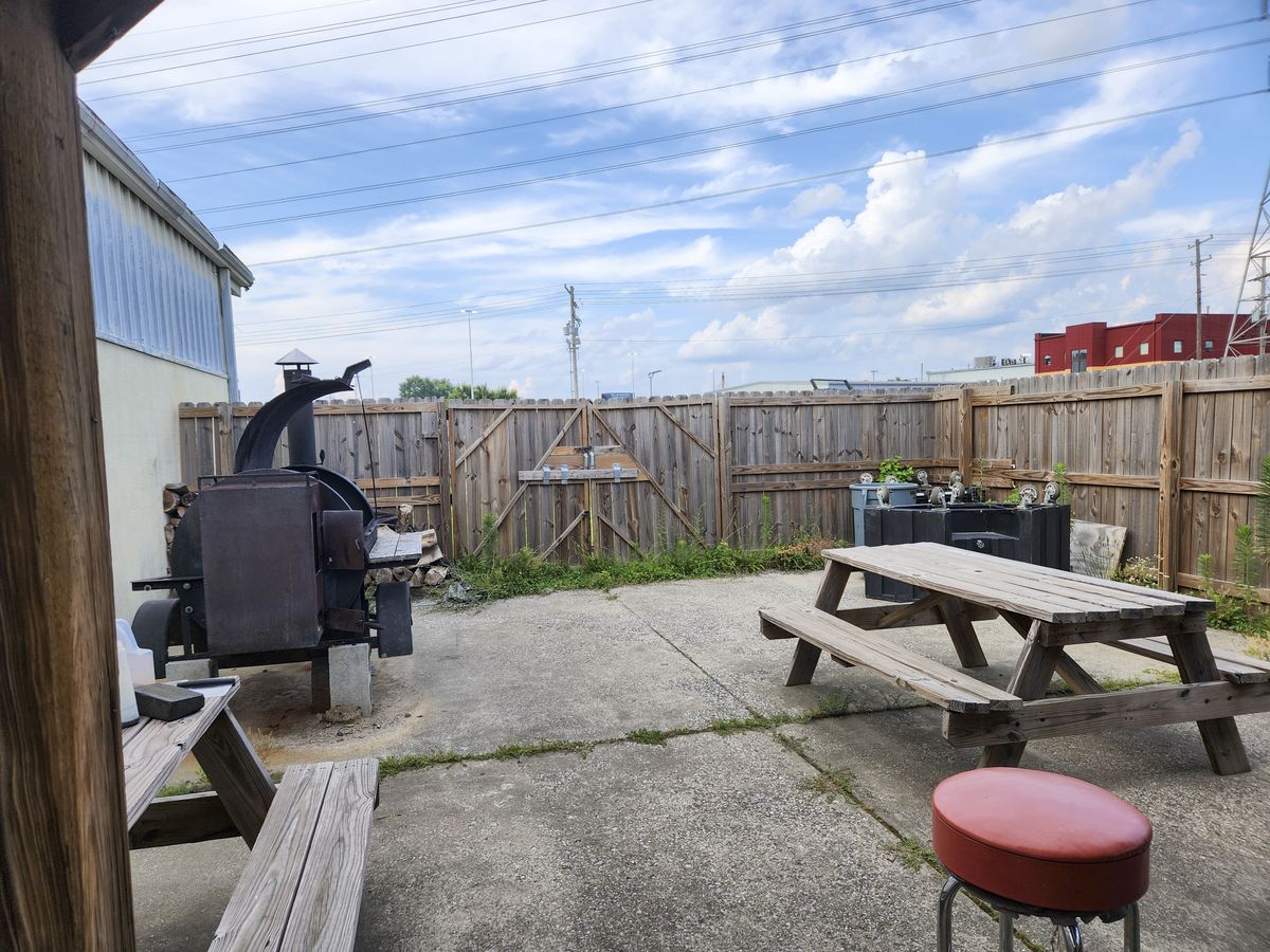 Rear patio and smoker at 4123 Flintlock Dr